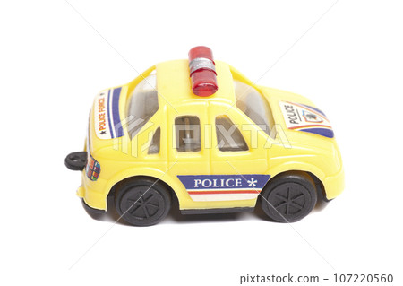 Yellow toy police car isolated on white background 107220560