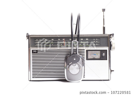 Vintage transistor radio with headphones 107220581