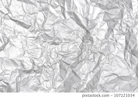 Silver crumpled paper texture background. Full frame 107221034