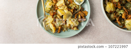 Fried young potatoes with Chanterelles Fried young potatoes with Chanterelles 107221997