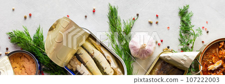 Open tin cans with canned fish Open tin cans with canned fish 107222003