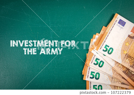 Investment for the army. Euro money on a green chalkboard Investment for the army. Euro money on a green chalkboard 107222379