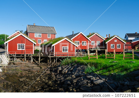 Norway. Fishermans red rorbu cottage in the Lofoten Islands. Typical Fishermans house. 107222651