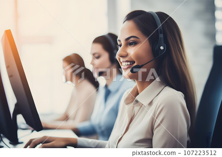 a pretty girl is an operator in a call center. the operator is a female agent  107223512