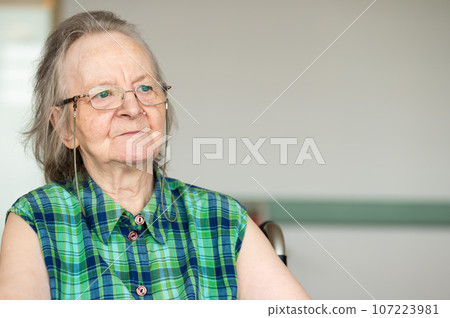 Portrait of a dreaming 84 yo white grandmother, Belgium Portrait of a dreaming 84 yo white grandmother, Belgium 107223981