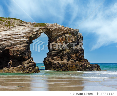 Natural arch on beach. Natural arch on beach. 107224558