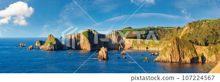 Evening Atlantic ocean coastline landscape. Beautiful Gueirua beach with rock formations, Asturias, Spain. 107224567