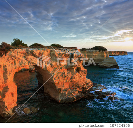 Surise Faraglioni at Torre Sant Andrea, Italy 107224596