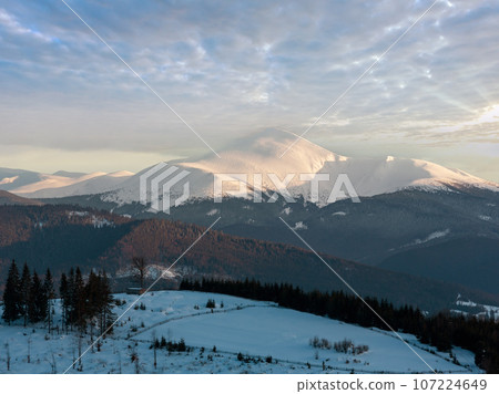 Evening winter cloudy day mountain ridge 107224649