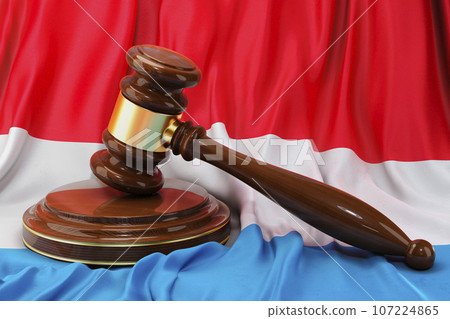 Luxembourgish law and justice concept. Wooden gavel on flag of Luxembourg, 3D rendering Luxembourgish law and justice concept. Wooden gavel on flag of Luxembourg, 3D rendering 107224865
