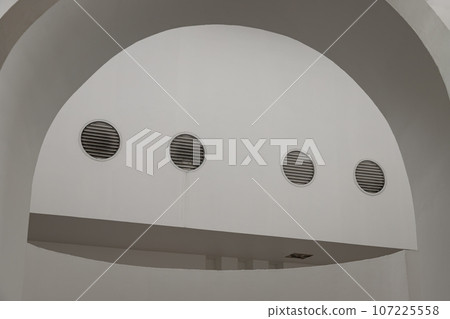 Sunlight shines through white arch interior design and white cement wall. Sunlight shines through white arch interior design and white cement wall. 107225558