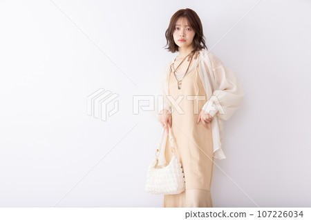 A young woman who takes a pose 107226034