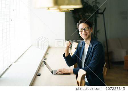 Man using a computer Man using a computer 107227845
