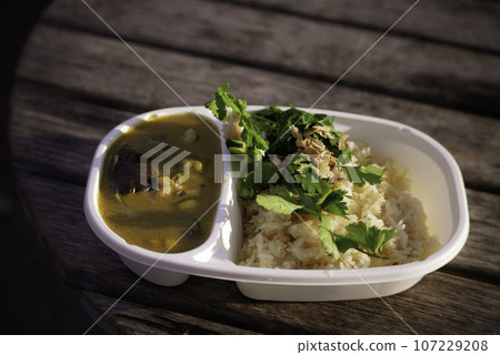 Green curry eaten outdoors Green curry eaten outdoors 107229208