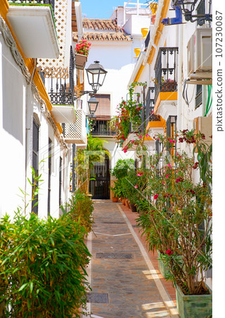 Colorful houses in the old town of Spain decorated with flowers 107230087