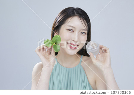 beauty concept photo of korean asain beautiful woman with cosmetic and a recycle bottle 107230366