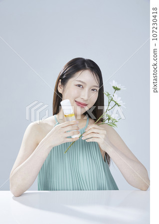 beauty concept photo of korean asain beautiful woman with cosmetic and a recycle bottle 107230418