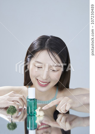 beauty concept photo of korean asain beautiful woman with mirror and cosmetic 107230489