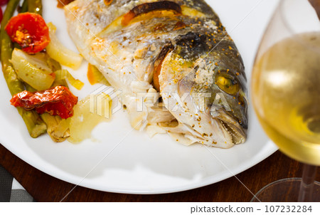 Grilled dorada with baked vegetables Grilled dorada with baked vegetables 107232284