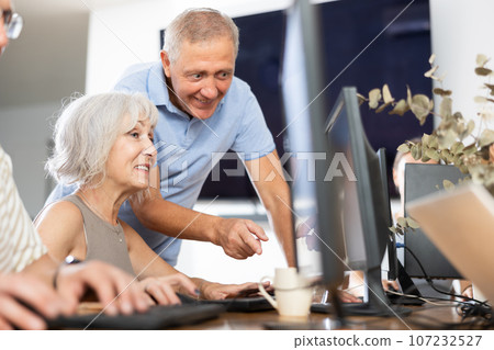 Group of older people studying on computer course 107232527