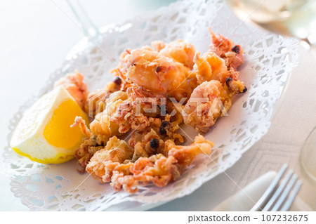 Chipirones, battered fried baby squid Chipirones, battered fried baby squid 107232675