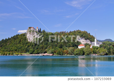 Lake Bled in Slovenia, southern Europe. Bled Castle stands on a cliff on the turquoise shore of the lake. 107233069