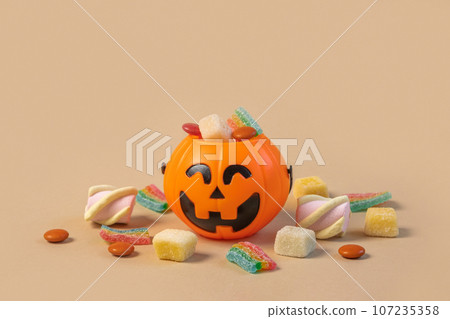 Halloween Jelly Beans. Happy Halloween Party Border Beige Background. Aesthetic Accessories Banner. Spooky Orange Pumpkin Candy Bucket. Modern Holiday Design. Thanksgiving Trendy Fall Poster 107235358