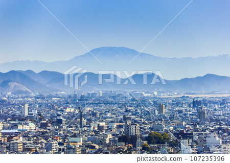 View of Mt. Ena over the Gifu city area View of Mt. Ena over the Gifu city area 107235396