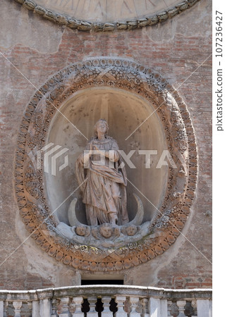 Virgin Mary statue on Clock tower of Palace of Reason (Palazzo della Ragione with the Torre dell'Orologio) in Mantua, Italy Virgin Mary statue on Clock tower of Palace of Reason (Palazzo della Ragione with the Torre dell'Orologio) in Mantua, Italy 107236427
