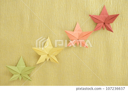 Origami maple leaves, green, yellow, orange, red, changing colors of maple leaves Origami maple leaves, green, yellow, orange, red, changing colors of maple leaves 107236637