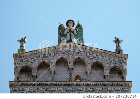Saint Michael on the top of the San Michele in Foro Church in Lucca, Italy 107236714
