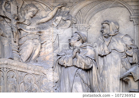 Relief on the portal of Saint Thomas Aquinas in Paris, France Relief on the portal of Saint Thomas Aquinas in Paris, France 107236952
