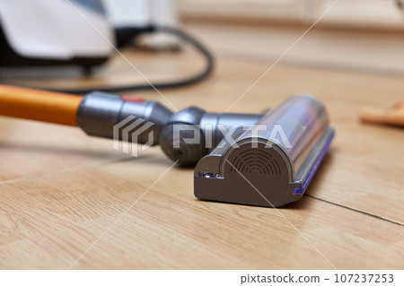 close-up, cordless vacuum cleaner on the floor. close-up, cordless vacuum cleaner on the floor. 107237253
