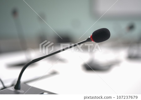 Close up microphone on table meeting room. Close up microphone on table meeting room. 107237679