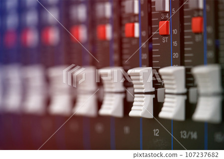 close-up audio mixing console, Selective focus. mixing and mastering tone control. close-up audio mixing console, Selective focus. mixing and mastering tone control. 107237682