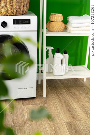 Laundry basket on washing machine in a laundry room Laundry basket on washing machine in a laundry room 107238265