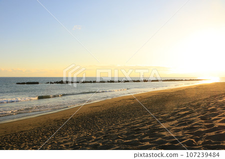 Sunset over the sea and sandy beach Sunset over the sea and sandy beach 107239484
