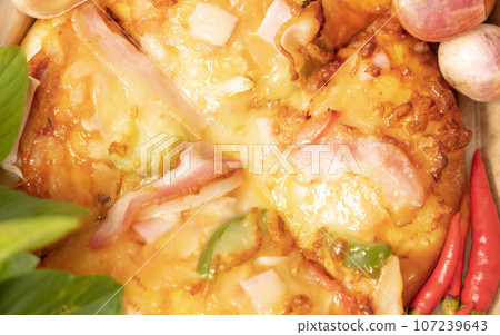 Pizza background in fast food close up with fresh paprika, garlic, shallots Pizza background in fast food close up with fresh paprika, garlic, shallots 107239643