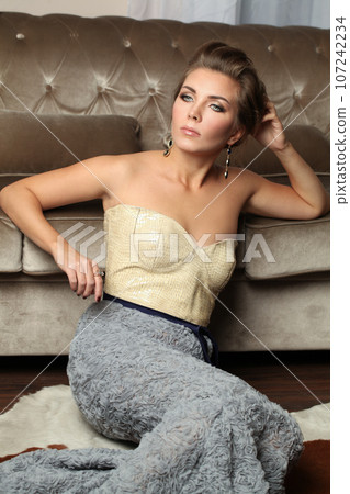 Glamorous fashion model woman resting in luxurious apartments room 107242234