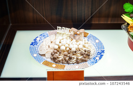Mixed mushroom set on plate. Different types of edible fungi Mixed mushroom set on plate. Different types of edible fungi 107243546