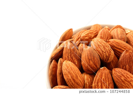 Almonds in a white cocotte Almonds in a white cocotte 107244858