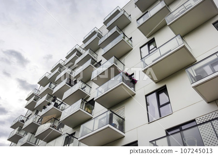 Modern exterior home with comfortable balconies.Modern apartment building design in Europe. Modern exterior home with comfortable balconies.Modern apartment building design in Europe. 107245013
