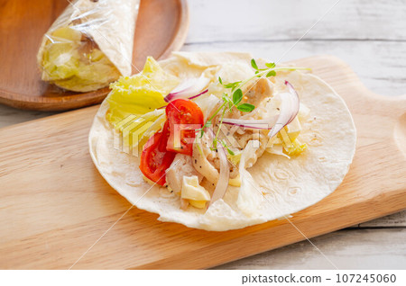 Making chicken wraps Making chicken wraps 107245060