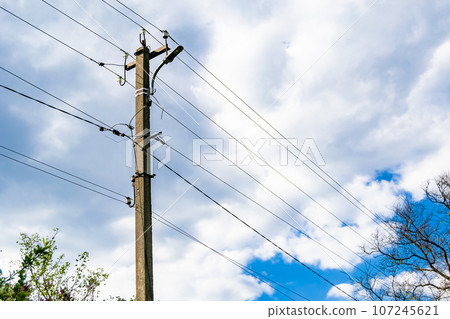 Power electric pole with line wire on colored background close up 107245621