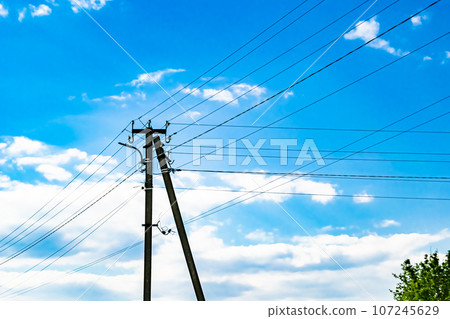 Power electric pole with line wire on colored background close up Power electric pole with line wire on colored background close up 107245629