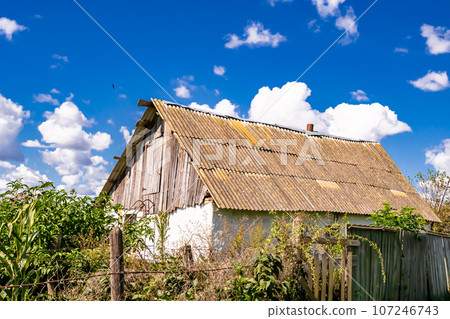 Beautiful old abandoned building farm house in countryside on natural background Beautiful old abandoned building farm house in countryside on natural background 107246743