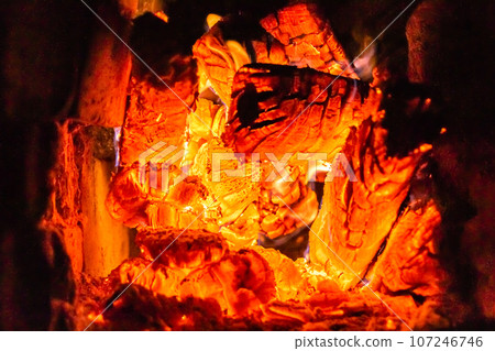 Beautiful old fireplace with light flame fire for heating building room Beautiful old fireplace with light flame fire for heating building room 107246746