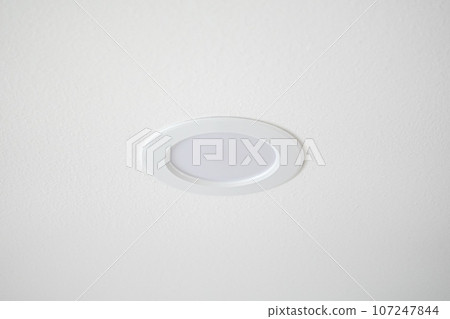 Clean white LED ceiling spotlight on the white wall 107247844