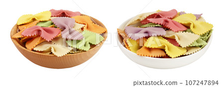 colorful farfalle pasta in wooden bowl isolated on white background with full depth of field colorful farfalle pasta in wooden bowl isolated on white background with full depth of field 107247894