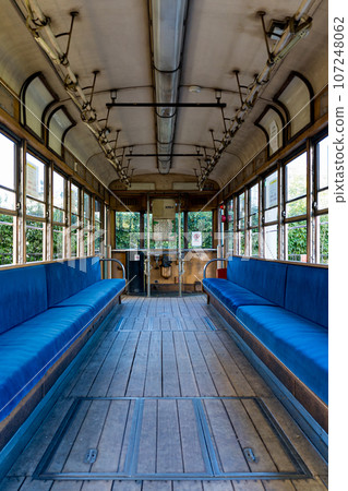 A train with a wooden floor that is no longer in use A train with a wooden floor that is no longer in use 107248062